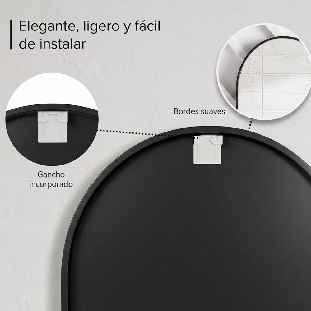 Espejo ovalado con cristal HD instalado sobre un lavabo doble en un baño moderno.