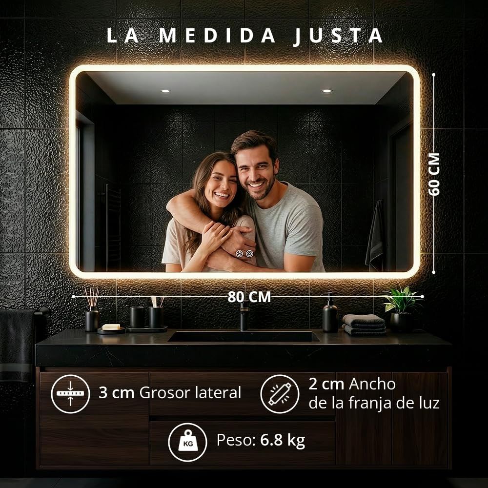 Espejo LED antivaho de 80x60 cm instalado sobre un mueble de doble lavabo en un baño moderno.