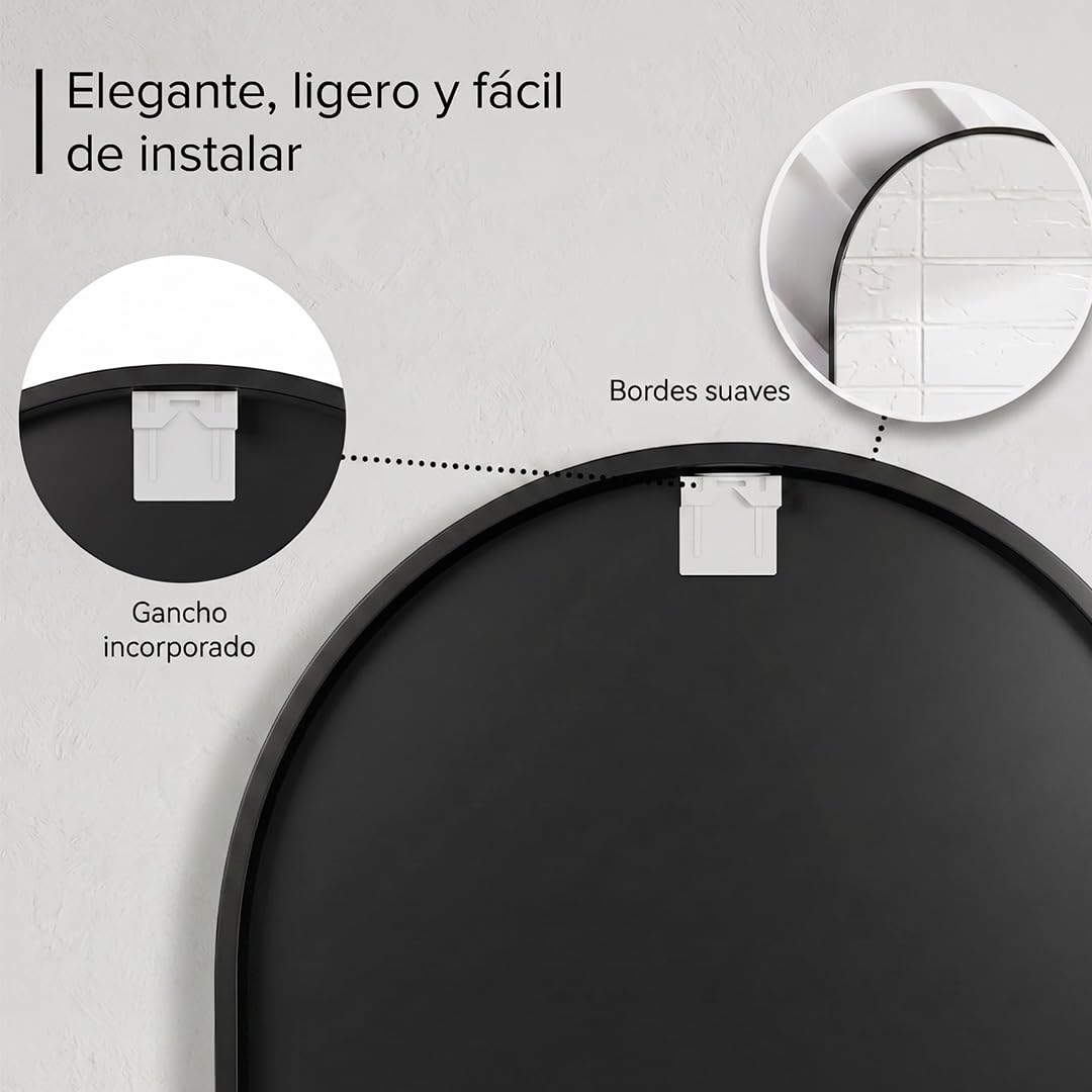 Espejo ovalado con cristal HD instalado sobre un lavabo doble en un baño moderno.